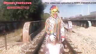 Clown almost gets hit by train while getting blowjob